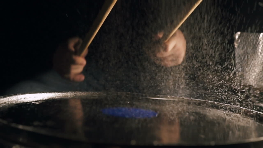 The drummer hits the wet drum. Slow motion Royalty-Free Stock Footage #1073957360