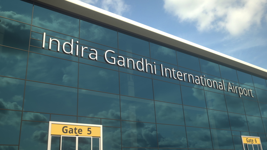 Airliner landing reflecting in the windows with Indira Gandhi International Airport text