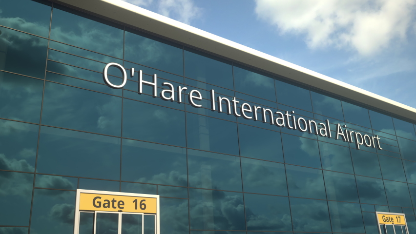 Commercial plane landing reflecting in the windows with O'Hare International Airport text Royalty-Free Stock Footage #1073961221