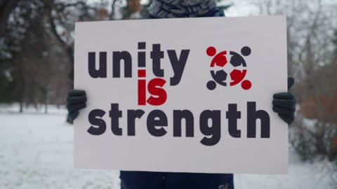 Unity Is Strength Slogan On Banner At Demonstration. Protesting Against Police Violence Towards Black People. Demonstration For Human Rights And Justice. Demanding End To Racism At Demonstration.