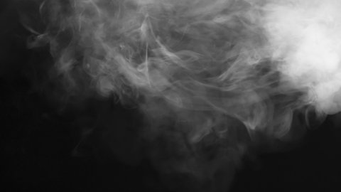 Gradual White Smoke Build-up. White smoke hangs floridly in the air and slowly spreads across the black screen
