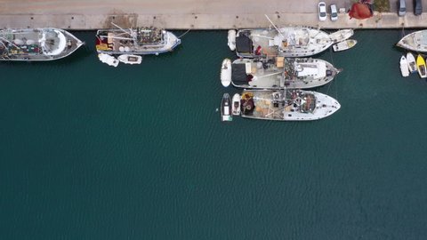Commercial Fishing Vessels Moored On Harbour Of Fish Farm In Kali, Ugljan Island, Croatia. - aerial