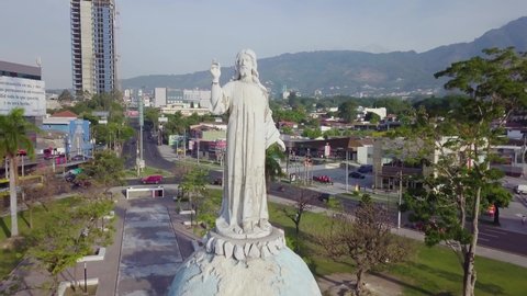 San Salvador , San Salvador , El Salvador - 05 13 2021: An aerial view of The monument of The Divine Savior of The World in the heart of the city during daytime,