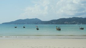White sand sea sky bright color no people boat background at Patong Beach Phuket,Thailand.Blue sea waves and sky on sand famous beach.