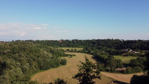 Europe, Italy , rome - drone aerial view of countryside  landscape hay bales to dry in a sunny field