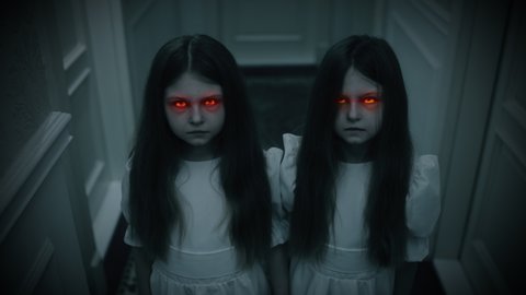 Evil twin girls with red beaming eyes staring into camera, witchcraft, horror. Paranormal events, ghost activity, horror scene