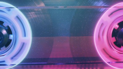 Vintage audio cassette, pink and blue neon animation,