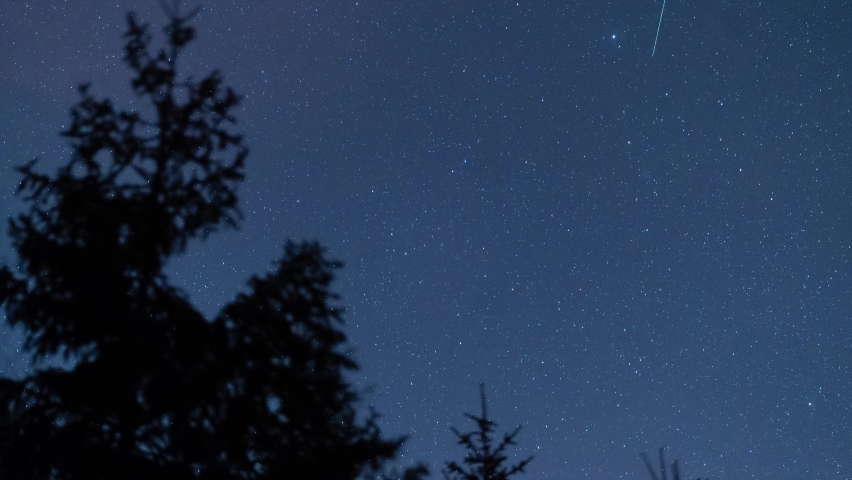 Night sky stars time lapse above central Europe. Star trail in the Beskydy Mountains Czech Republic. High quality 4k footage