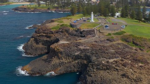 Blowhole Peninsula With Kiama Lighthouse In Kiama, NSW, Australia. - aerial