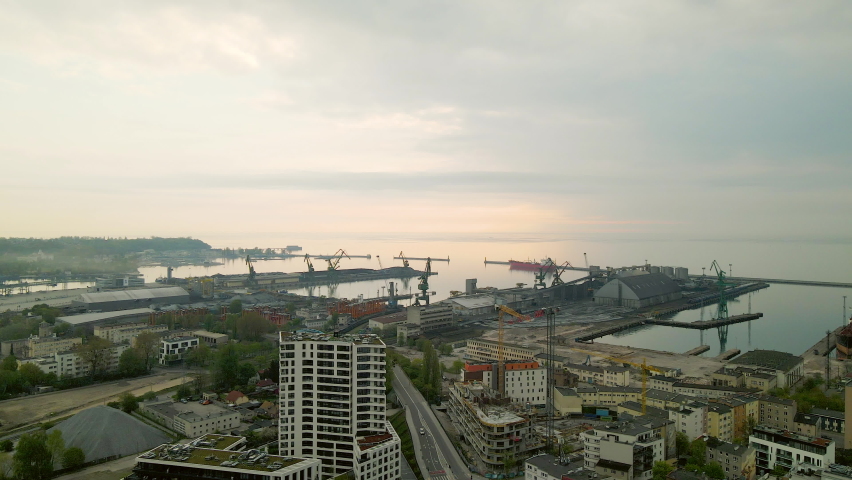 Beautiful sunset drone view of Gdynia Poland ship port urban city buildings on Baltic Sea