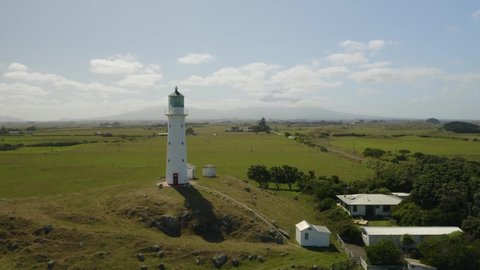 Cape Egmont Lighthouse on New Zealand's North Island. Located West of Egmont National Park. Mt. Taranaki in the Background