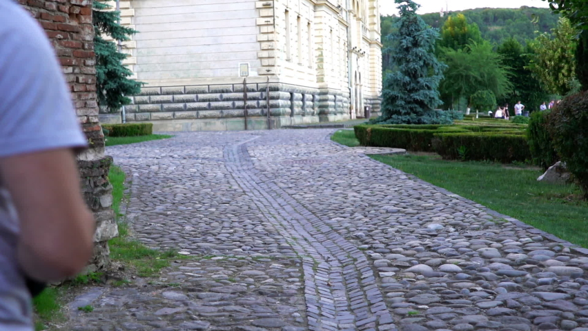 Young man taking photo with digital camera in the city