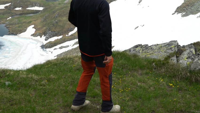 Young man admire view in the mountains