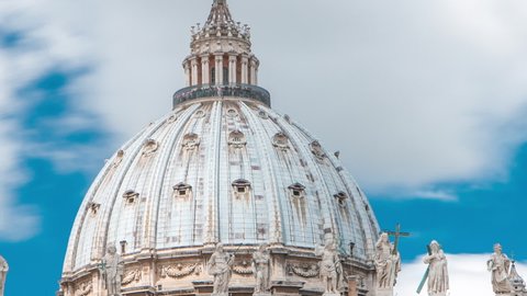 Top of Basilica di San Pietro timelapse in the Vatican City, Rome, Italy. Blue cloudy sky