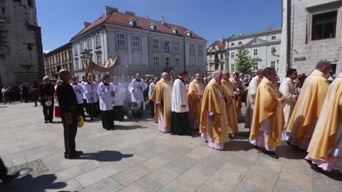 Cracow, Malopolska, Poland - 06.03.2021: Priests taking part
in Corpus Christi procession. Cardinal Stanislaw Dziwisz, (in red) ex-archbishop of Cracow and a long-time secretary of Pope John Paul II