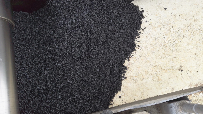 Road construction. Asphalt pavement machine making new layer of asphalt. Abstract view from above, an Industrial Video by Nikola Spasenoski