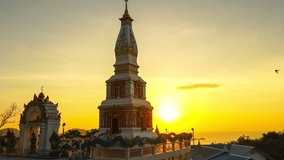 timelapse stunning sky at sunset behind beautiful pagoda. Sunset over ocean. Scene of Colorful romantic sky sunset, Summer and travel vacation concept.
