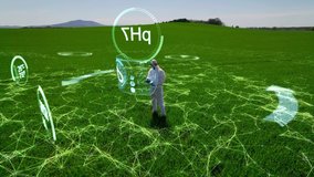 A scientist, a farmer conducts research on a farmland using augmented reality. Future-proof tools for cultivating plants, modern management of an agricultural enterprise. - Powered by Shutterstock - Get 15% off with code: PIKWIZARD15