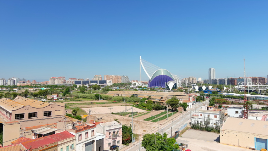 Valencia: Aerial view of city in Spain, modern city part, City of Arts (Sciences Ciudad de las Artes y las Ciencias) skyline on horizon, sunny with blue sky - landscape panorama of Europe from above