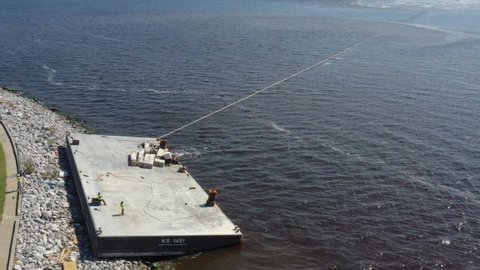 Hurricane Sally Pensacola, Barge being pulled from shore