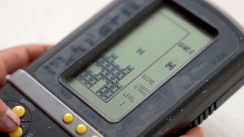 Tetris game on a retro electronic portable console