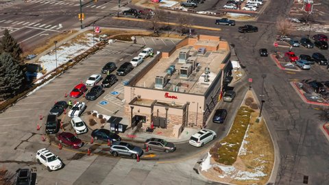 federal heights , Colorado , United States - 03 02 2021: Aerial zoom hyperlapse view of Chick-Fil-A drive-thru