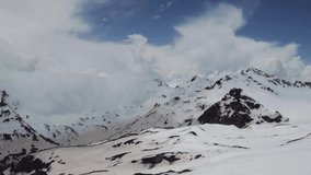 Rocky peaks of Elbrus are covered with clouds, timelapse video, time-lapse video shooting