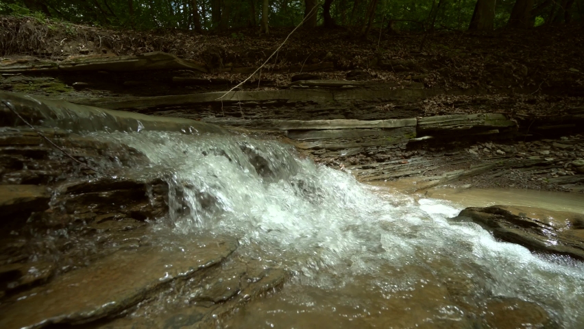 Beautiful mountain landscape scene with flowing river and bright reflection