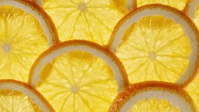Macro Shot of Sliced Orange Fruit Slices and Rotate. Orange Fruit Pattern. Healthy Food Background. Slow Motion. - Powered by Shutterstock - Get 15% off with code: PIKWIZARD15