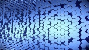 Video animation of an abstract background of moving hexagons in blue - seamless loop