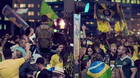 Sao Paulo , Sao Paulo , Brazil - 10 28 2018: Crowd of supporters of the president elected Jair Messias Bolsonaro celebrate his victory in Paulista Avenue, the most iconic of the financial capital of B