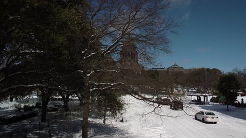 AUSTIN , TX , United States - 02 15 2021: Congress Avenue and the Texas State Capitol building covered in snow