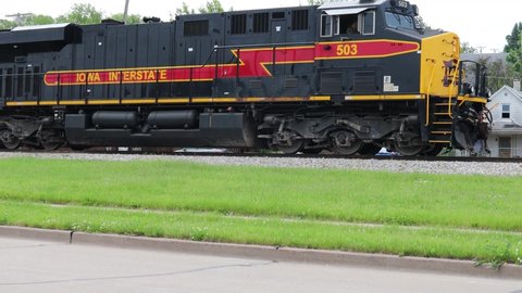 Rock Island , Illinois , United States - 05 28 2021: Iowa Interstate Railroad Locomotive Pushing Train Cars on the Track