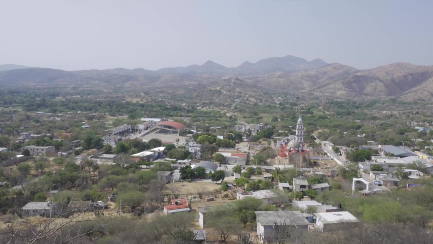 High angle shot of plants and hills on a sunny day in Mixteca Poblana, Puebla, Mexico