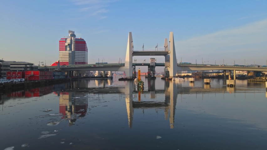 Hisingsbron Bridge Under Construction Reflecting On Gota Alv River In Gothenburg, Sweden. - aerial
