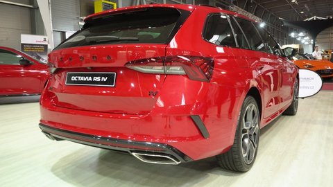 PRAGUE, CZECH REPUBLIC - AUGUST 28, 2020: Rear view of a red Skoda Octavia RS iV at a car exhibition - other cars and people in the background