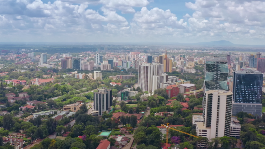 Aerial view cityscape of Nairobi Kenya. High-rise buildings in downtown with beehives with traffic in the African capital in the savannah with a textured sky.