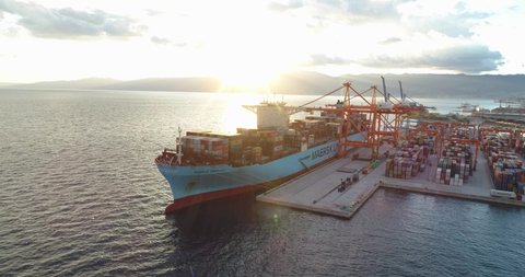 Rijeka , Croatia - 01 20 2021: International container cargo ship in port, aerial drone view 