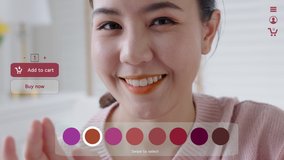 POV asia young teen girl relax happy smile enjoy buy home apply lips makeup ai ar vr mixed augmented reality e-commerce store future fashion mall app in iot smart touch swipe select color web screen. - Powered by Shutterstock - Get 15% off with code: PIKWIZARD15