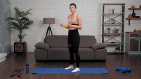 Fit woman fitness trainer blogger in sportswear teaches tells students shows correct sports exercises for hands. Muscular girl athlete record online remote webinar master class course, workout at home