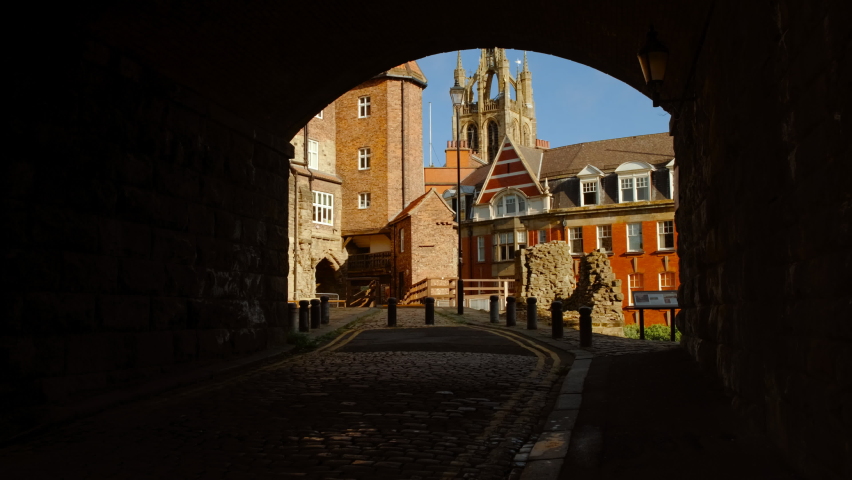 Entering the Black Gate of Newcastle, England, UK, built in 1250 during the reign of King Henry III, revealing the medieval barbican Royalty-Free Stock Footage #1074149438
