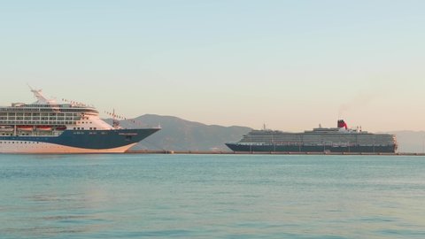 CORFU, GREECE, SEPTEMBER 27, 2019: Tui Marella Discovery and Queen Victoria cruise anchored in city port.