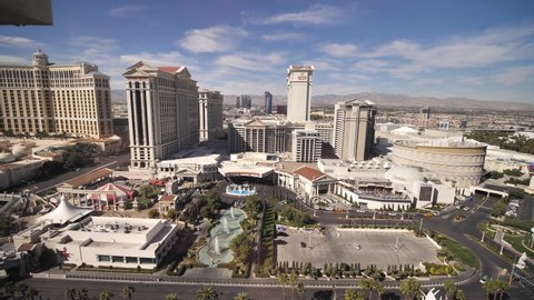 Las Vegas , Nevada , United States - 04 22 2021: Caesars Palace and Bellagio, Iconic Hotels and Casinos on Strip, Window Revealing View, Slow Motion