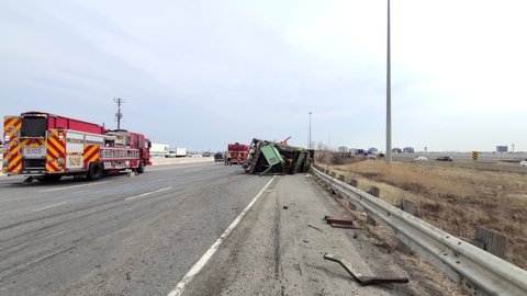Toronto , Canada - 06 04 2021: Toronto Fire Services manage a serious road traffic accident involving an overturned Semi Truck