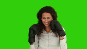 Chroma-key footage of an African-american woman with boxing gloves