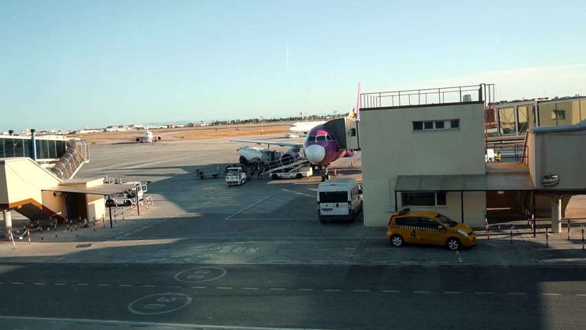 Valencia , Spain - 08 19 2018: Airport Workers Loading Baggages And Cargo Into An Aircraft