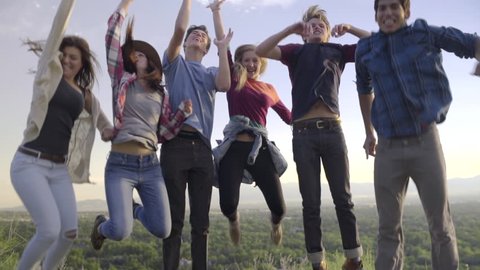 Group Of Teens Jump In The Air At Scenic Overlook (Slow Motion)