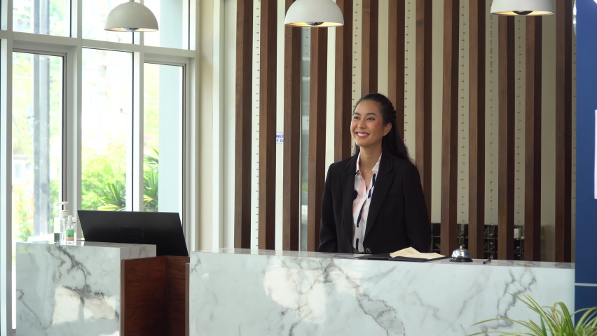 thai receptionist welcome and greeting with Thai wai at hotel thailand Royalty-Free Stock Footage #1074174398