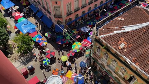 Manaus, AM, Brazil - June 12, 2021: Aerial view of people shopping in an open street market located in downtown amid the Coronavirus, COVID-19 pandemic.