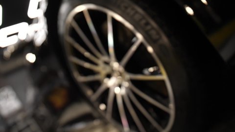 Lutsk, Volyn  Ukraine - February 23, 2021: Mercedes-Benz S-Class. Wheel and tire of a new car. In the center of the alloy wheel is the emblem of Mercedes. Camera movement on it.